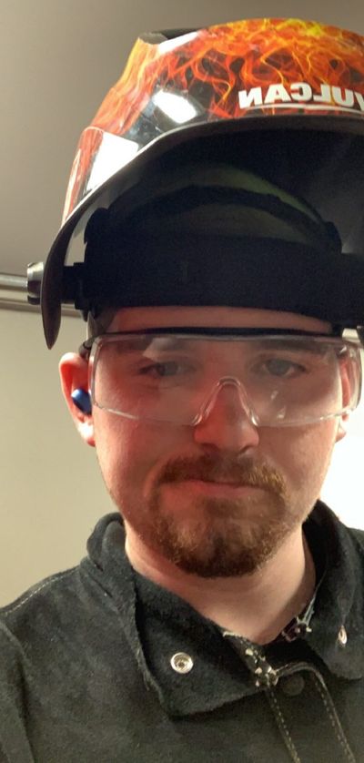 JT King in a welding helmet